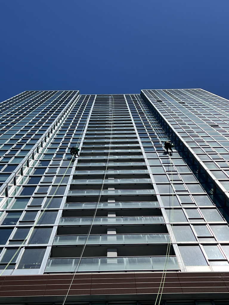 Washing exterior windows of a high rise apartment building