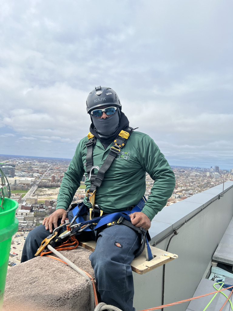 High rise window washer in full safety gear ready to start shift