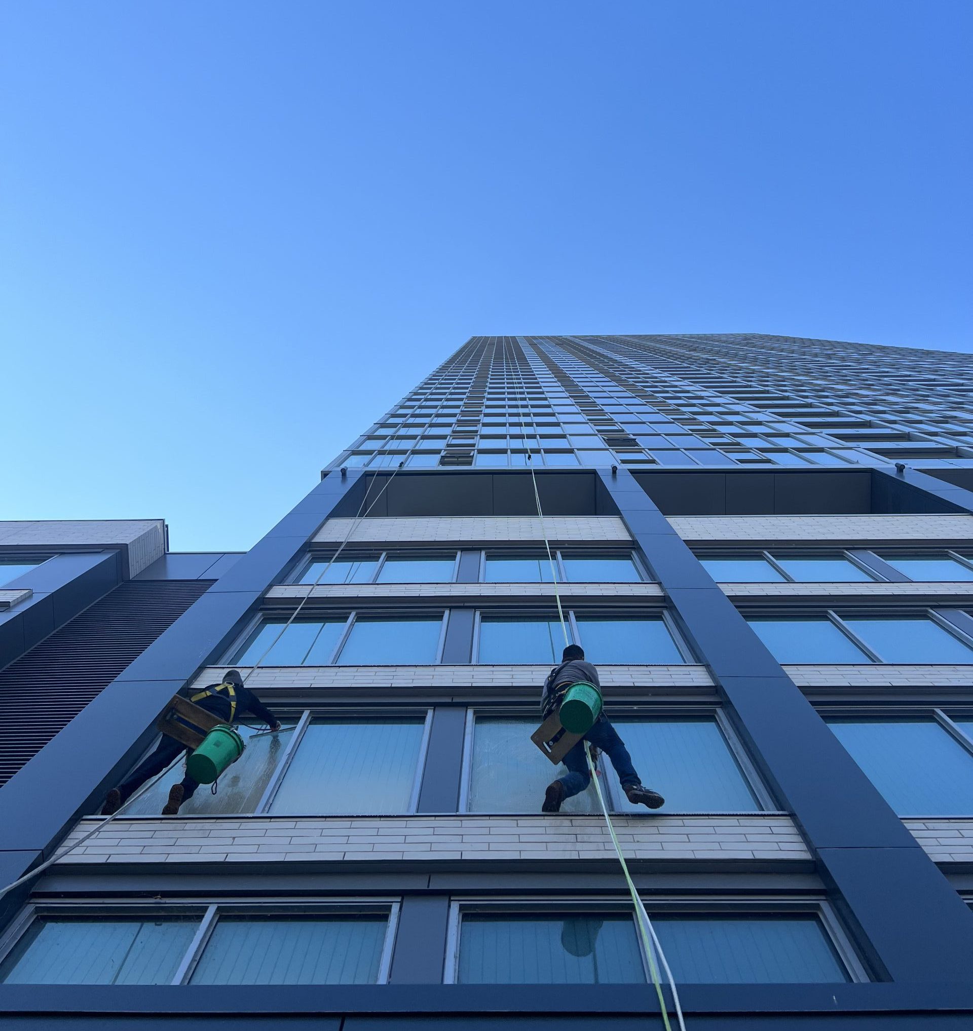 Green Clean window washers cleaning the windows of a Chicago high rise building.